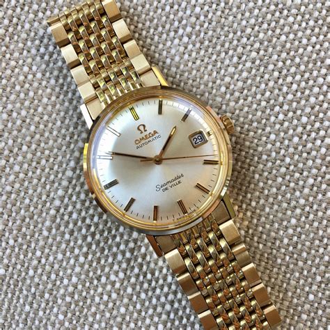 omega seamaster gold vintage price.